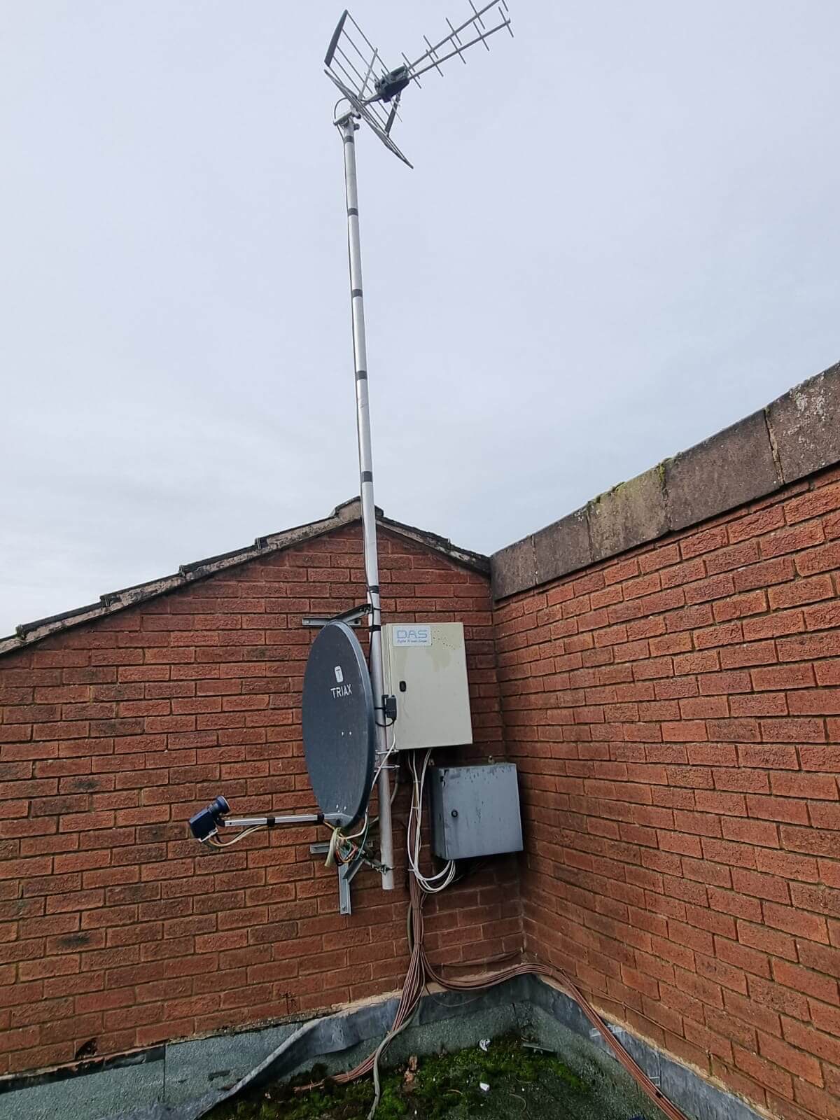 TV aerial and satellite equipment installed on a brick building